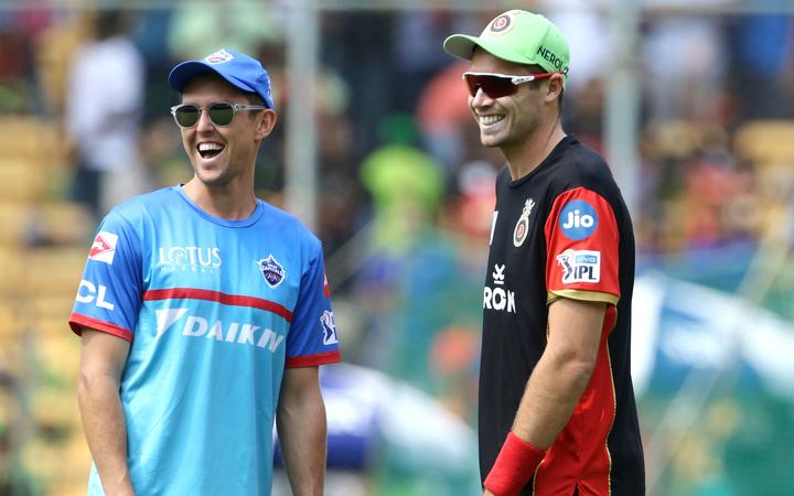 Trent Boult of Delhi Capitals and Tim Southee of Royal Challengers Bangalore  before the start of the match 20 of the Vivo Indian Premier League Season 12, 2019 between the Royal Challengers Bangalore and the Delhi Capitals held at the M Chinnaswamy Stadium in Bengaluru on the 7th April 2019