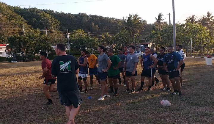 Guam rugby coach Tony Penn (closest to camera) puts the team through their paces in training.
