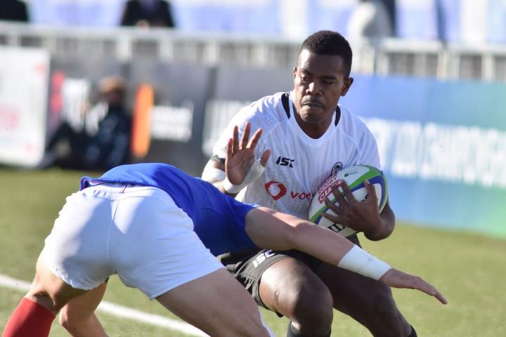 Fiji fullback Osea Waqa challenges the French defence.