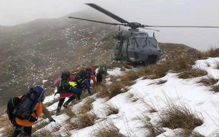 Teams 17 and 20 are extracted from Tarn Ridge in the Tararua Ranges during the search for missing tramper Darren Myers.