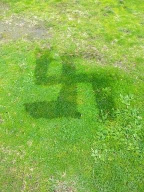 Nazi swastika etched into grass berm at Kāpiti Coast.