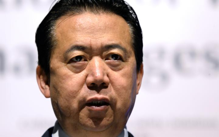 (FILES) In this file photo taken on July 4, 2017, Meng Hongwei, president of Interpol, speaks at the opening of the Interpol World Congress in Singapore. 