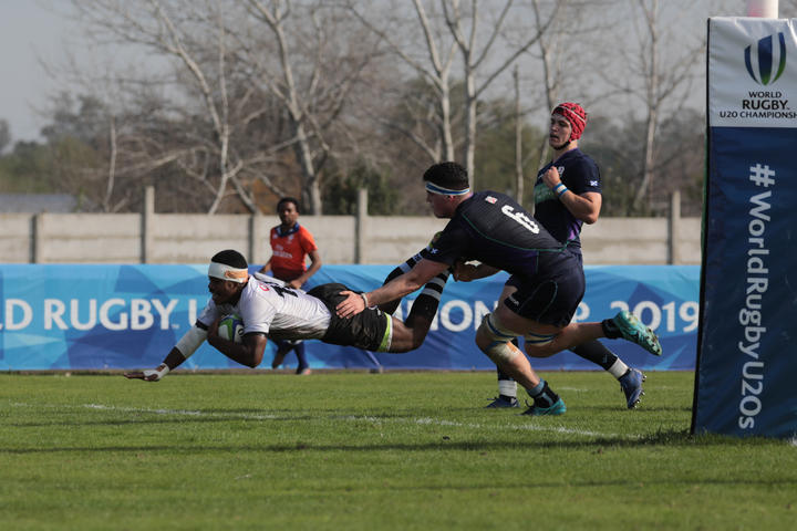 Fiji full-back Osea Waqa dives to score his second try in their 11th place semi-final with Scotland.