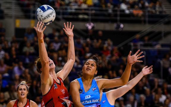 Kate Beveridge of the Tactix gets the ball underpressure from Taneisha Fifita of the Steel.
