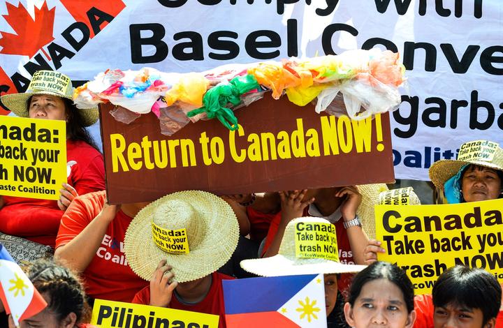 Environmental activists,  protest outside the Canadian embassy in Manila on May 21, 2019, to push the government of Canadian Prime Minister Justin Trudeau to speed up the removal of their garbage o