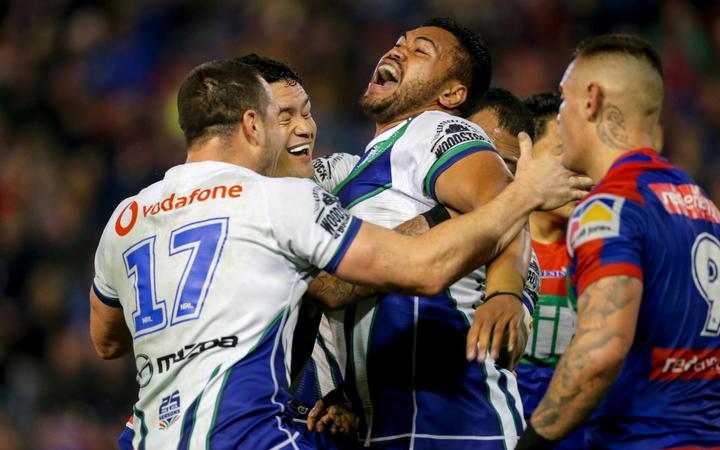 Warriors prop Sam Lisone celebrates his match-winning try against the Knights in Newcastle.