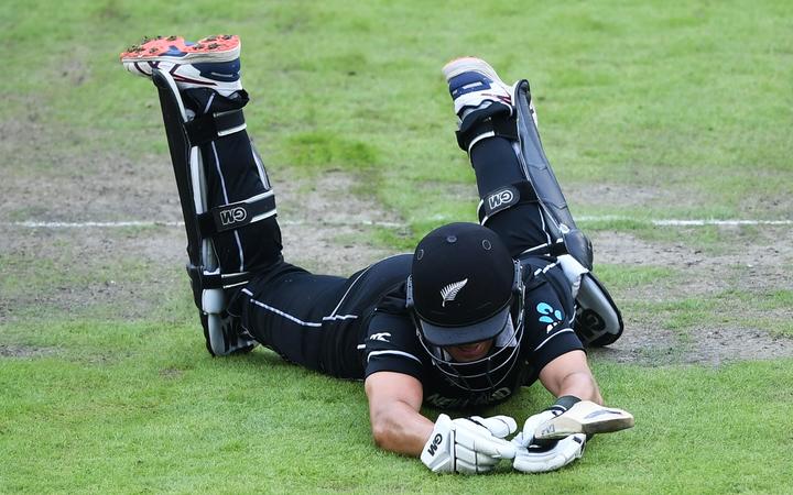 Ross Taylor dives for his crease.
