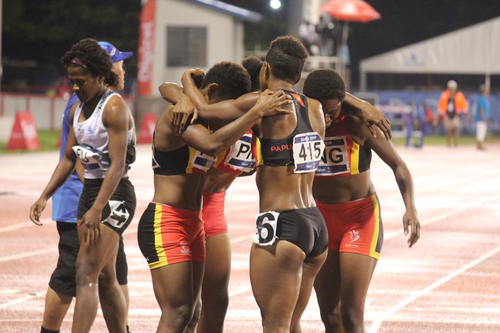 PNG celebrate defending the women's 4x400m relay title.
