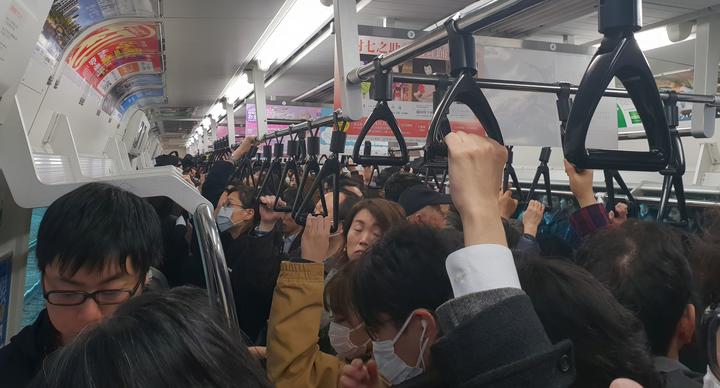 Typically packed subway car in Tokyo.