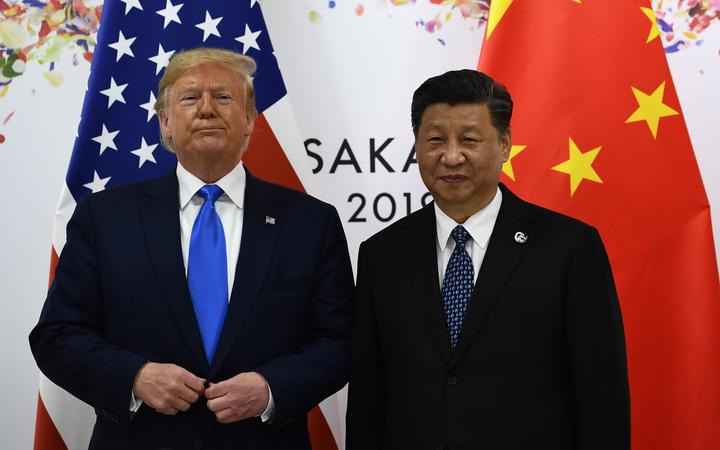 Chinese President Xi Jinping (R) and US President Donald Trump attend their bilateral meeting on the sidelines of the G20 Summit in Osaka on June 29, 2019. (Photo by Brendan Smialowski / AFP)