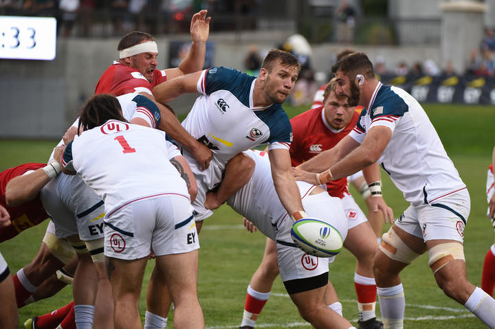 The USA get an offload away against Canada during their opening round win.