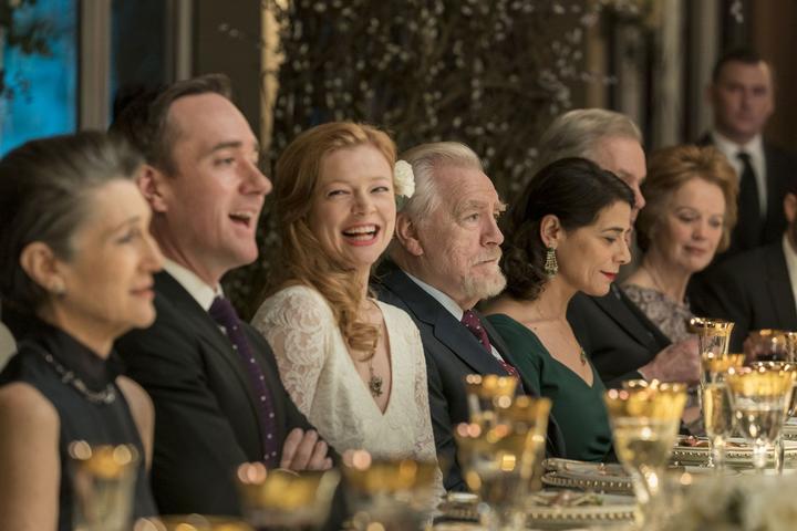 Logan Roy (Brian Cox) prepares to toast at the wedding of his daughter Shiv (Sarah Snook) to Tom (Matthew McFadyen), flanked by his second wife (Harriet Walter) and his third (Hiam Abbas).