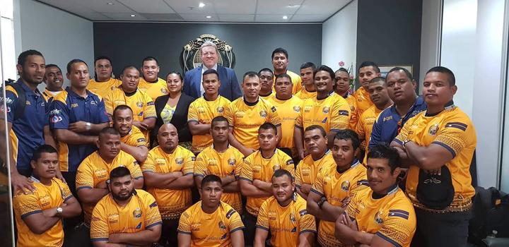 The Nauru Rugby team with their new kit presented by the vice president of the Queensland Rugby Union Garrick Morgan (Back row in suit) at the Nauru Consulate office in Brisbane. August 2019