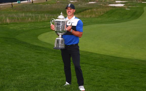 Brooks Koepka of the United States poses with the Wanamaker Trophy after winning the 2019 PGA Golf Championship.