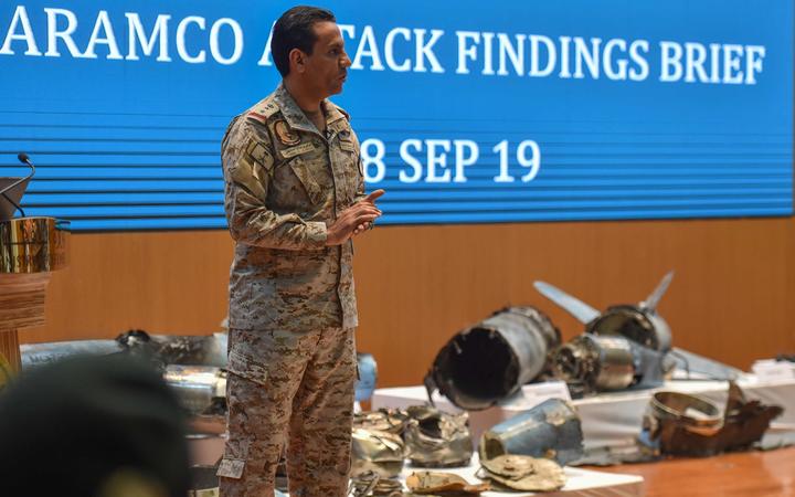 Saudi defence ministry spokesman Colonel Turki bin Saleh al-Malki shows pieces of what he said were Iranian cruise missiles and drones recovered from the attack site that targeted Saudi Aramco's facilities, 18 September 2019.