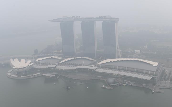 This overview shows the Marina Bay Sands hotel and resort blanketed by haze in Singapore on September 18, 2019. 