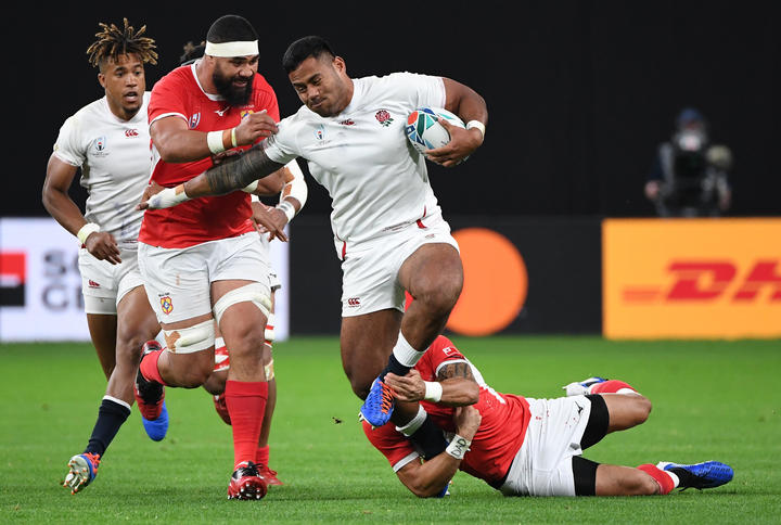 Manu Tuilagi scored two of England's four tries in a man of the match performance.