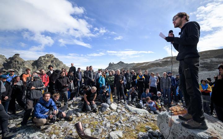 People take part in a ceremony to mark the 'death' of the Pizol glacier (Pizolgletscher) on September 22, 2019 above Mels, eastern Switzerland. 