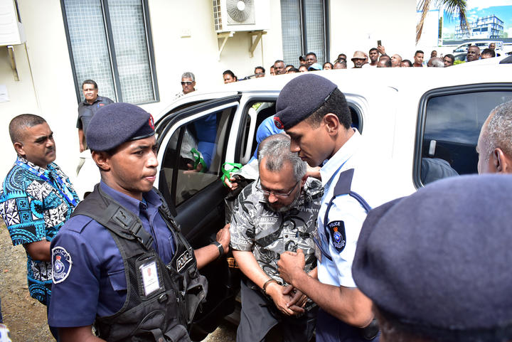 Police officers escort the murder suspect Muhammed Raheesh Isoof to the remand centre from Nadi Magistrates Court on September 18.
