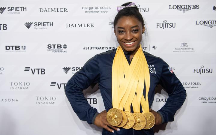 Simone Biles with her gold medals from the 2019 Gymnastics World Championships in Stuttgart.