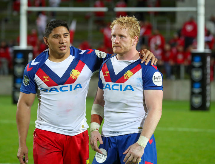 Tonga's Jason Taumalolo consoles Lions captain James Graham.
