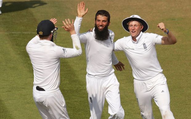 Bowler Moeen Ali celebrates with Joe Root (right) and Sam Robson (left) after Chris Jordan catches Cheteshwar Pujara during the third Investec Test Match between England and India at the Ageas Bowl, Southampton. 2014.
