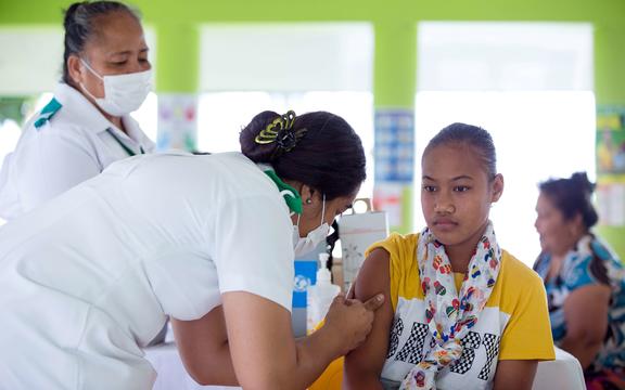This picture released from UNICEF Samoa shows a girl receiving a vaccine during a nationwide campaign against measles in the Samoan town of Le'auva'a.  