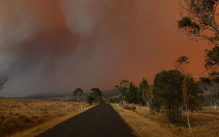 Ember and thick smoke from bushfires reach Braemar Bay in New South Wales on January 4, 2020. 