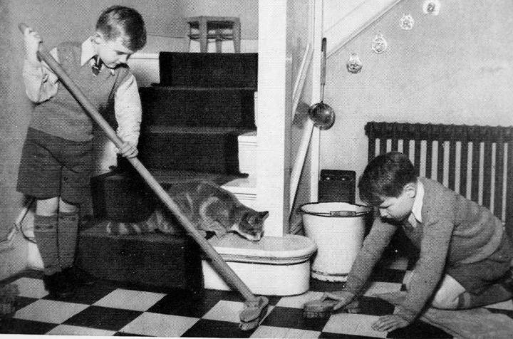 Young children completing household tasks