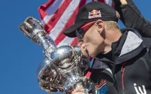 Oracle Skipper James Spithill kisses the Auld Mug after winning the America's Cup in 2013.