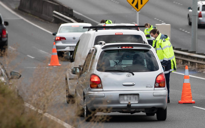 Police check motorists going on motorway in Auckland the day before the Easter long weekend begins.