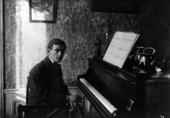 Portrait of Maurice Ravel (1875 - 1937) at the piano.