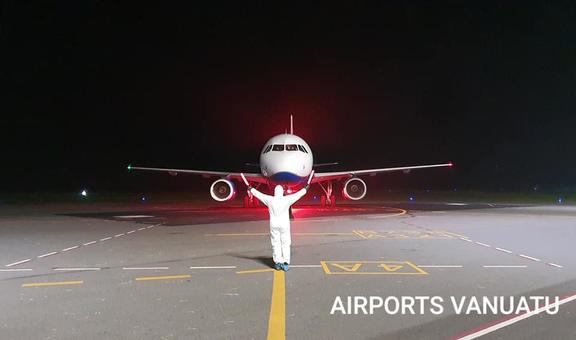 A plane arrives at Vanuatu Airport under strict Covid-19 prevention protocols. April 2020
