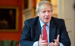 A handout image released by 10 Downing Street, shows Britain's Prime Minister Boris Johnson recording a video message for Captain Tom Moore's 100th birthday, inside 10 Downing Street in central London on April 29, 2020. - 