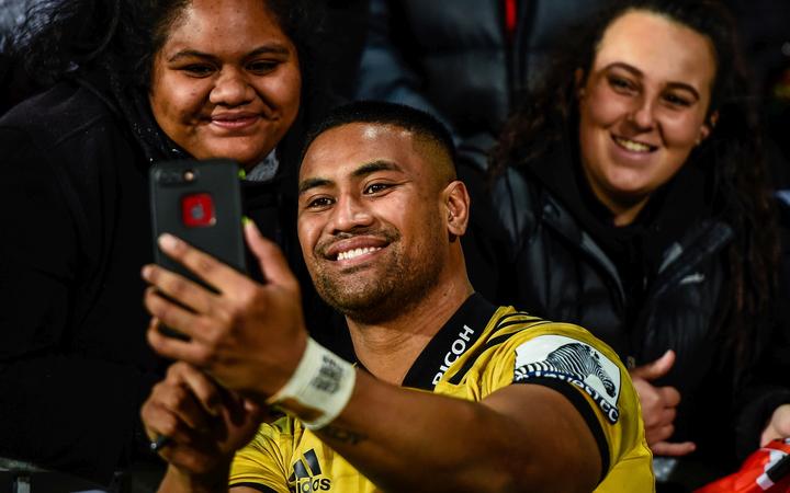 Julian Savea of the Hurricanes with fans. 