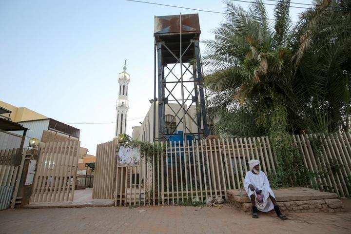 A Sudanese man outside a closed mosque in the capital Khartoum during the Muslim holy month of Ramadan amid a curfew due to the COVID-19 coronavirus pandemic. 