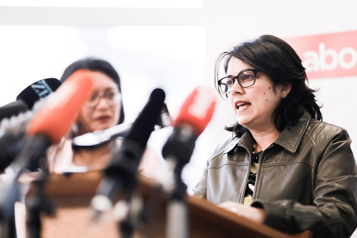 Ayesha Verrall (at podium)