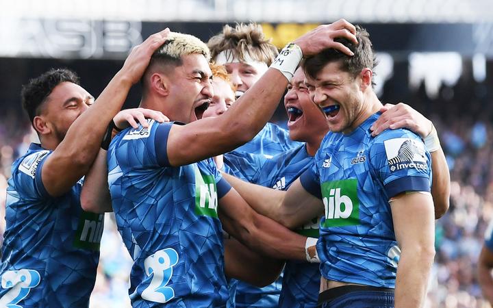 Blues players celebrate fullback Matt Duffie's try.