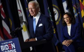Democratic vice presidential running mate, US Senator Kamala Harris, listens to presidential nominee and former US Vice President Joe Biden speak during their first press conference together in Wilmington, Delaware, on August 12, 2020. 