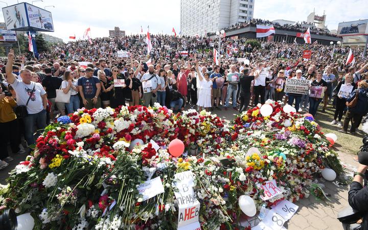 Belarus opposition supporters gather near the Pushkinskaya metro station where Alexander Taraikovsky, a 34-year-old protester died on August 10, during their protest rally in central Minsk, Belarus. 