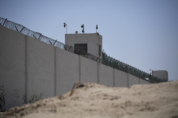 The outer wall of a complex on the outskirts of Hotan, believed to be a re-education camp where mostly Muslim ethnic minorities are detained, in Xinjiang province.