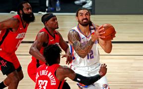 LAKE BUENA VISTA, FLORIDA - AUGUST 20: Steven Adams #12 of the Oklahoma City Thunder shoots the ball against Robert Covington #33 of the Houston Rockets during the first quarter in game two in the first round of the 2020 NBA Playoffs on August 20, 2020 in Lake Buena Vista, Florida. 