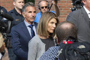 Actress Lori Loughlin and husband Mossimo Giannulli exit the Boston Federal Court house after a pre-trial hearing last year.