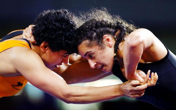 Ana Moceyawa of New Zealand competes against Pooja Dhanda of India at the Women's Freestyle 57 kg Group match. Gold Coast 2018 Commonwealth Games