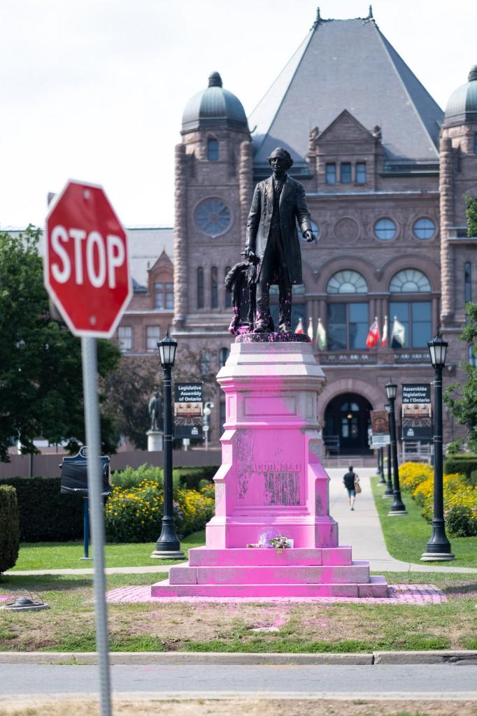 Three Black Lives Matter Toronto activists have been arrested after having thrown pink paint on three official statues which represent a Canadian history of colonialism and slavery.