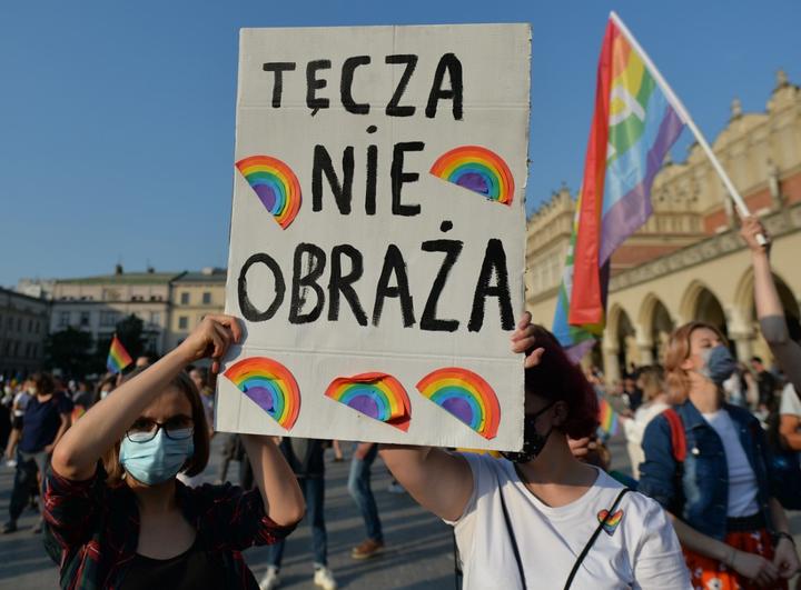 Two Pro-LGBT activists holds 'The rainbow does not offend' placard during the annual Krakow Equality March 2020.