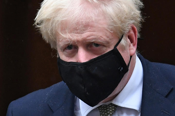 Britain's Prime Minister Boris Johnson wearing a face mask  leaves 10 Downing Street ion October 12, 2020 headed for the House of Commons, where he is set to announce a new Covid-19 alert system.