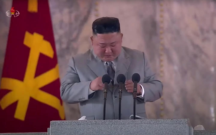 North Korean leader Kim Jong Un, as seen from a KCTV broadcast on October 10, 2020, pausing as he makes a speech prior to a military parade on Kim Il Sung square in Pyongyang. 