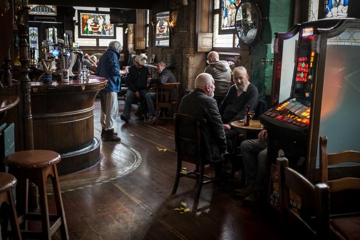Clients visiting Lismore pub in Glasgow.  PM Nicola Strugeon announced on the same day new circuit breaker restrictions affecting pubs and restaurants to counter COVID-19 pandemic for two weeks starting Friday night.