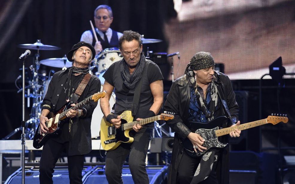 Springsteen plays his guitar alongside the E Street Band